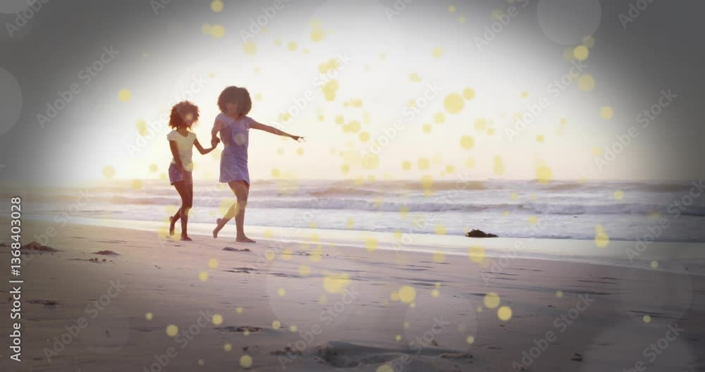 Poster running on beach, two children with golden light particles animation overlay