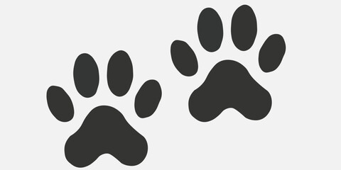 A simple yet striking black paw print is centered on a white background, symbolizing animal presence and connection. This design evokes feelings of warmth and companionship.