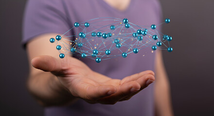 Man Presenting Glowing Blue Network of Spheres in His Open Hand on Gray Background