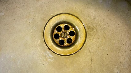 Old dirty metal sink, drain. Old iron kitchen sink. Old rusty sink.