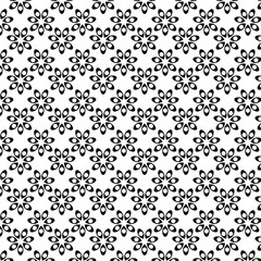 Black dot in floral shape on white background.