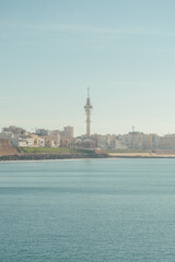 Fototapeta premium View of the city of Cadiz from the sea. Landscape of the city of Cádiz with the famous Tavira II telecommunications tower.