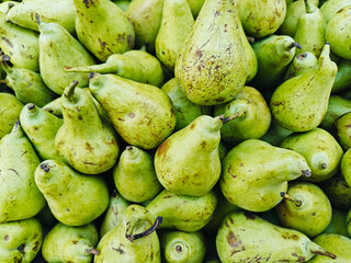A pile of fresh delicious ripe pears open sell in Indian market.