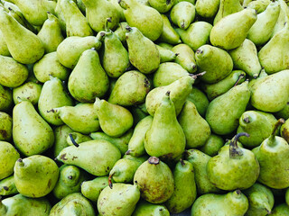 A pile of fresh delicious ripe pears open sell in Indian market.