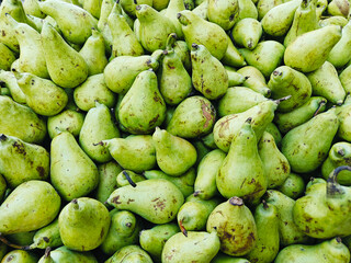 A pile of fresh delicious ripe pears open sell in Indian market.