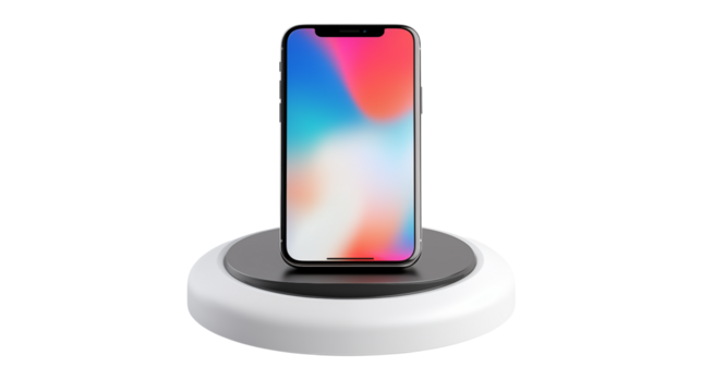 A smartphone with a colorful screen sitting on a gray and white round charging pad device