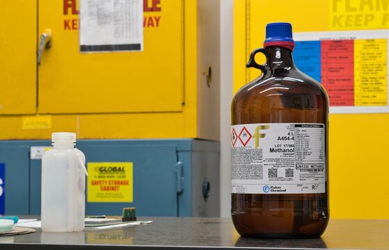 Methanol bottle hazardous materials flammable warning labels on laboratory table Houston, Texas USA 03-02-2025.
