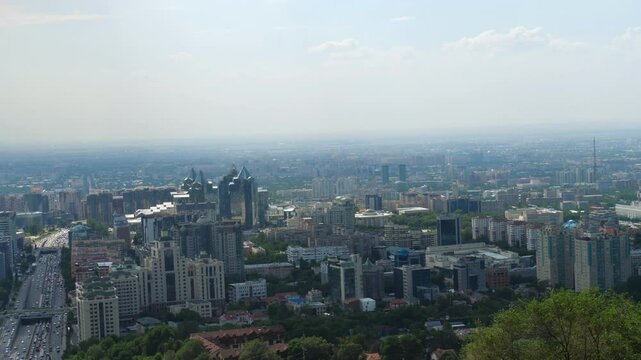 Panoramic view of Almaty from the top of Kok Tobe Hill, city architecture and urban landscape in the heart of the Republic of Kazakhstan