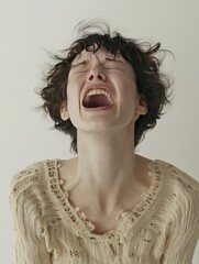 woman expressing extreme emotion, tears streaming down her face

