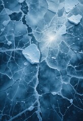 Obraz premium A close up of the cracked ice background with a bluish-gray tint and transparent areas. The network of cracks creates a unique pattern that highlights the frosty beauty of winter nature.
