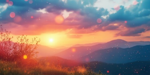 Obraz premium Colorful sunset over mountains with clouds and natural foliage in the foreground during a serene evening