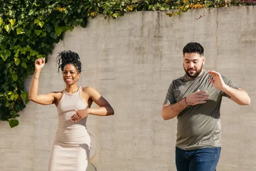 Couple of dancers performing cuban salsa in the street
