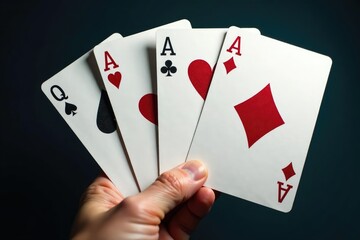 Obraz premium Four aces fanned out, showcasing their unique designs, clubs, game