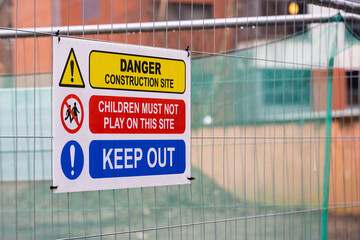 Blue, Red, Yellow and White Children Keep Out Construction Site Warning Sign on Temporary Heras...