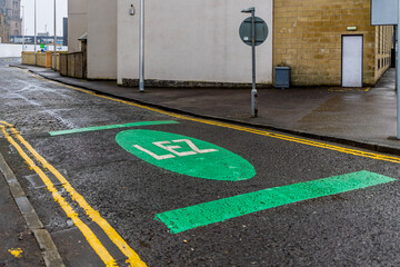 Low Emission Zone Entry Point with LEZ Painted Sign on Tarmac Road Surface at Boundary of City...