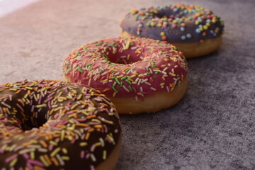 Three colorful donuts