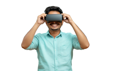 Cheerful Indian man in a light blue shirt holding a VR headset confidently, PNG transparent background, isolated, studio shot.

