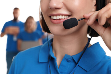 Technical support call center. Smiling operator on white background, closeup