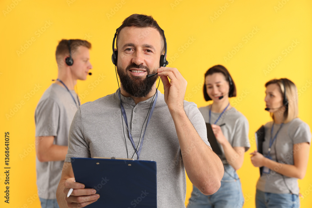 Poster technical support call center. smiling operator on yellow background, selective focus