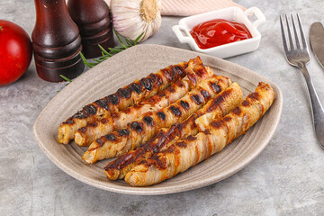Grilled meat sausages wrapped bacon