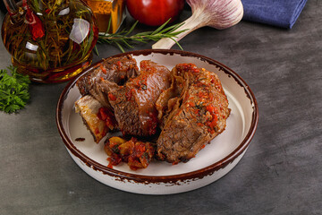 Baked beef ribs with vegetables