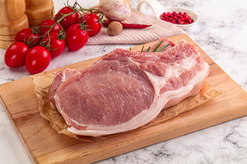 Raw potk loin steak with bone