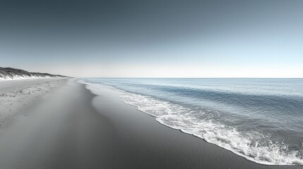 Serene beach scene, waves gently lapping shore.