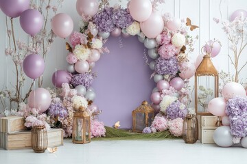 Pastel purple backdrop with balloon garland lanterns and flowers