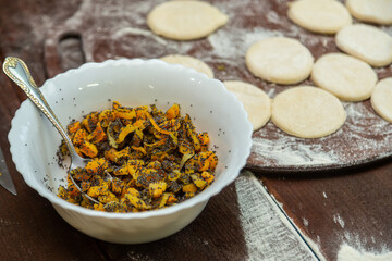Baking tray with vegetable oil is greased with a brush