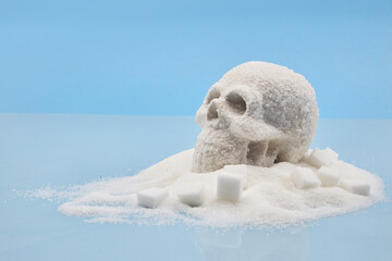 A skull-shaped pile of sugar surrounded by sugar cubes