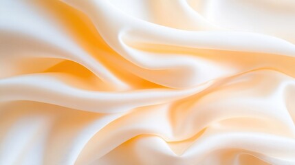 Fototapeta premium Smooth, flowing, pale peach silk fabric drapes in soft, elegant folds
