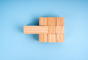 Completed wood blocks. One of them is wrong type of block . Building a successful business team concept