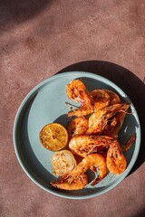 Marinated shrimp in a spicy grill with lime and garlic. Delicious fresh seafood, Mediterranean cuisine.