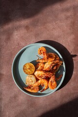 Marinated shrimp in a spicy grill with lime and garlic. Delicious fresh seafood, Mediterranean cuisine.