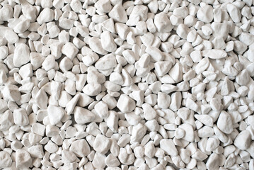 White pebbles texture background. Natural small smooth stones for landscaping, garden decoration, and design elements.