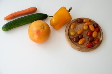 Bright culinary ingredients, vegetables and microgreens are laid out on the table near the wooden cutting board. Healthy Eating