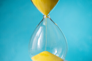 hourglass on blue background