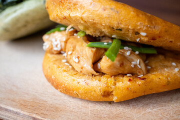 Bao buns breads with chicken,meat and mushrooms close-up	