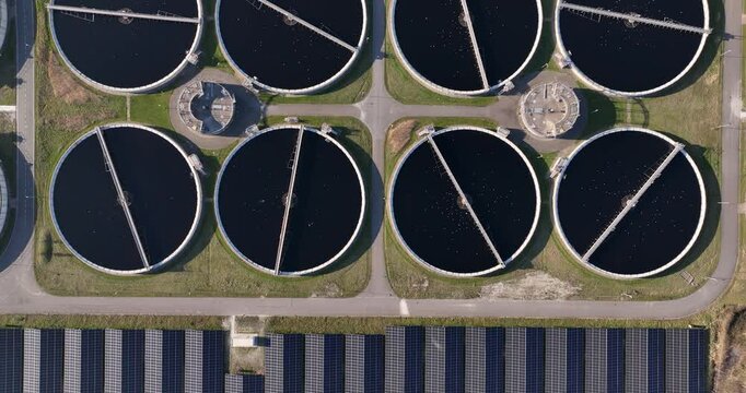 Waste water treatment facility in The Netherlands. Circular basins full of water.
