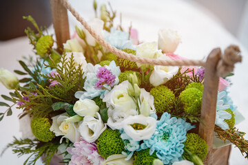 Bouquet of fresh flowers in a basket