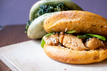 Bao buns breads with chicken,meat and mushrooms close-up	