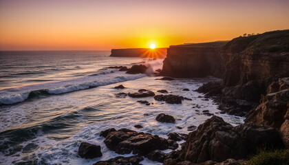 The ocean is calm and the sun is setting, casting a warm glow over the rocky shore. The waves are small and gentle, creating a peaceful atmosphere