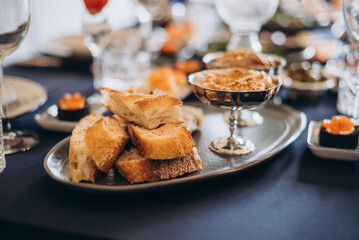 Delicious bread platter with hummus on a beautifully set table for a gathering