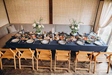 Elegant dining setup features fresh ingredients and beautiful arrangements in a cozy interior