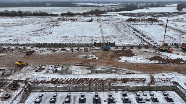 Large-scale construction in sub-zero temperatures, in the freezing cold. Technologies of building construction in the Far North. Base construction in permafrost conditions