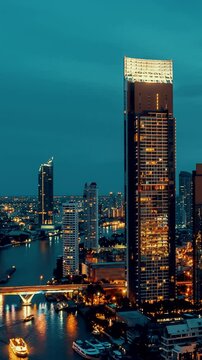 Day and night transition time lapse of cityscape and buildings in metropolis . Downtown city center business district in panoramic view .