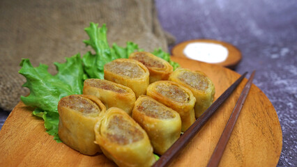 Crispy Fried Chicken Roll with Mayonnaise on Wooden Cutting Board – Delicious Snack