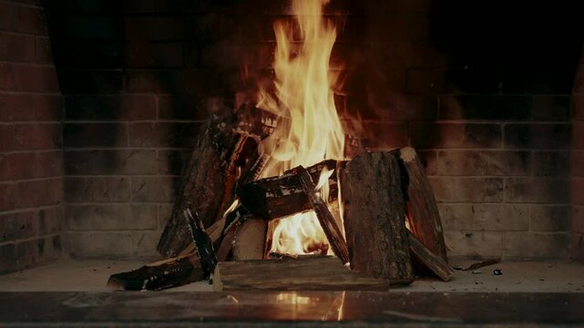 Wood is burning in the fireplace

