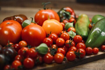 Fresh varieties of vegetables, beautifully laid out on the kitchen table, healthy vegetables without chemicals. Close-up.