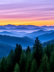 Obraz premium Serene sunset over layered, hazy blue mountains and evergreen forest